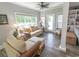Relaxing living room with plush couches, a ceiling fan, and a view of the outdoors at 521 Oak Lawn Rd., Georgetown, SC 29440