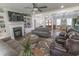 Comfortable living room with a fireplace, built-in shelving, and an open layout to the dining area at 521 Oak Lawn Rd., Georgetown, SC 29440