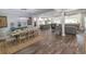 Spacious living area seamlessly connects the dining, kitchen, and living spaces with wood floors and an open layout at 521 Oak Lawn Rd., Georgetown, SC 29440