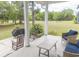 Relax on this covered porch with comfortable seating, perfect for enjoying the outdoors in style and comfort at 521 Oak Lawn Rd., Georgetown, SC 29440