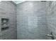 Stylish shower featuring gray subway tile and a built-in decorative niche at 521 Oak Lawn Rd., Georgetown, SC 29440