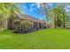 Expansive backyard with lush green grass and mature trees, perfect for outdoor activities and relaxation at 5647 S Blackmoor Dr., Murrells Inlet, SC 29576