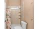 Bright bathroom featuring shower with custom curtain and tiled wall at 5647 S Blackmoor Dr., Murrells Inlet, SC 29576