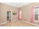 Bright bedroom with soft lighting and adjoining bathroom, ideal for relaxation and comfort at 5647 S Blackmoor Dr., Murrells Inlet, SC 29576