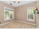 Bright bedroom featuring two large windows and neutral carpet at 5647 S Blackmoor Dr., Murrells Inlet, SC 29576