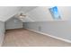 Bright bonus room with skylights and a ceiling fan, offering ample space and natural light at 5647 S Blackmoor Dr., Murrells Inlet, SC 29576