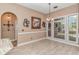 Cozy breakfast nook with tiled floors, bright windows, and views of the outdoors, ideal for casual dining at 5647 S Blackmoor Dr., Murrells Inlet, SC 29576