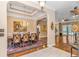 Elegant dining room featuring hardwood floors, a chandelier, and views into adjacent living spaces, ideal for gatherings at 5647 S Blackmoor Dr., Murrells Inlet, SC 29576
