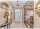 Elegant foyer with tile flooring, arched doorways, and a view into the dining room, creating a welcoming entrance at 5647 S Blackmoor Dr., Murrells Inlet, SC 29576