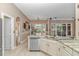 Bright and spacious kitchen with granite countertops, stainless steel appliances, and outdoor view at 5647 S Blackmoor Dr., Murrells Inlet, SC 29576