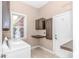 Functional laundry room with washer, dryer, cabinets, and exterior access at 5647 S Blackmoor Dr., Murrells Inlet, SC 29576