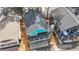 Aerial view of a home with a dark roof, teal accent, and a grey deck at 6001 S Kings Hwy., Myrtle Beach, SC 29575