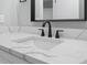 Stylish bathroom with a sleek undermount sink and modern black faucet fixtures at 6001 S Kings Hwy., Myrtle Beach, SC 29575