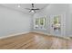 Bright bedroom featuring a ceiling fan, natural light, and light wood-look flooring at 6001 S Kings Hwy., Myrtle Beach, SC 29575