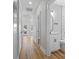 Hallway view featuring light-colored walls and modern bathroom at 6001 S Kings Hwy., Myrtle Beach, SC 29575