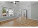 Bright living room with hardwood floors and abundant natural light from large windows at 6001 S Kings Hwy., Myrtle Beach, SC 29575