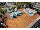Spacious wooden deck with seating and grill, perfect for outdoor relaxation and entertainment at 6001-1205 S Kings Hwy., Myrtle Beach, SC 29575