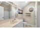 Well-lit bathroom offering a vanity, and octagonal window to let in natural light at 6001-1205 S Kings Hwy., Myrtle Beach, SC 29575