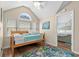 Bright bedroom featuring wood floors, vaulted ceilings, arched window, and coastal decor with a twin bed at 6001-1205 S Kings Hwy., Myrtle Beach, SC 29575