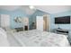Bright bedroom featuring vaulted ceilings, ensuite bath, and light blue walls create a relaxing atmosphere at 6001-1205 S Kings Hwy., Myrtle Beach, SC 29575