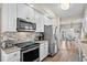 Well-equipped kitchen with stainless steel appliances and a view to the dining area at 6001-1205 S Kings Hwy., Myrtle Beach, SC 29575