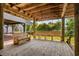 Large picnic bench under home with wood flooring and space to hang a hammock at 6001-1205 S Kings Hwy., Myrtle Beach, SC 29575