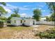 View of the rear of the home showcasing its backyard, patio, and exterior at 617 Sparrow Dr., Surfside Beach, SC 29575