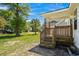 The back deck has wooden rails and faces the fenced-in backyard at 617 Sparrow Dr., Surfside Beach, SC 29575
