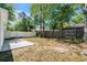 Large backyard featuring a concrete patio and privacy fencing, ideal for relaxation at 617 Sparrow Dr., Surfside Beach, SC 29575