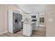 Modern kitchen featuring stainless steel appliances, bright white cabinetry, and a kitchen island at 617 Sparrow Dr., Surfside Beach, SC 29575