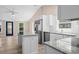 Open-concept kitchen features stainless appliances, shaker cabinets and granite countertops at 617 Sparrow Dr., Surfside Beach, SC 29575