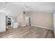 Open-concept living space flows into the kitchen with a hardwood floor at 617 Sparrow Dr., Surfside Beach, SC 29575