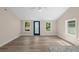 Bright living room features neutral walls, modern ceiling fan, and durable wood-look flooring at 617 Sparrow Dr., Surfside Beach, SC 29575