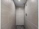 This shower features gray tiling and a pebble floor at 617 Sparrow Dr., Surfside Beach, SC 29575