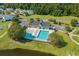 Aerial view of community pool and clubhouse surrounded by lush landscaping at 622 Oakhurst Dr., Myrtle Beach, SC 29579