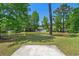 Backyard showing beautiful pond view and lush landscaping creating a private oasis at 622 Oakhurst Dr., Myrtle Beach, SC 29579
