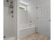 Modern bathroom featuring a shower, tub combo and bright natural light at 622 Oakhurst Dr., Myrtle Beach, SC 29579