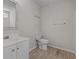 Bright bathroom with a modern vanity, toilet and chrome towel bars at 622 Oakhurst Dr., Myrtle Beach, SC 29579