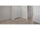 Inviting bedroom with wood-look floors, a closet, and a bright window at 622 Oakhurst Dr., Myrtle Beach, SC 29579