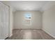 Cozy bedroom featuring wood-look floors, a closet and bright window at 622 Oakhurst Dr., Myrtle Beach, SC 29579