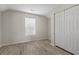 Charming bedroom with wood-look floors, a closet and bright window at 622 Oakhurst Dr., Myrtle Beach, SC 29579