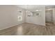 Open dining area features modern chandelier, natural light and connection to kitchen at 622 Oakhurst Dr., Myrtle Beach, SC 29579