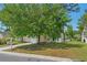 Charming single Gathering home with attached garage, mature trees, and well-manicured lawn at 622 Oakhurst Dr., Myrtle Beach, SC 29579