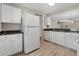 Well-lit kitchen with white cabinets, appliances, and an open design at 622 Oakhurst Dr., Myrtle Beach, SC 29579