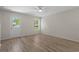 Living room featuring modern wood flooring, ceiling fan and bright natural light at 622 Oakhurst Dr., Myrtle Beach, SC 29579
