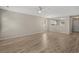 Bright living room with an open layout connects to the kitchen, featuring wood floors at 622 Oakhurst Dr., Myrtle Beach, SC 29579