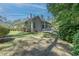 Spacious backyard featuring a patio, sunroom, and lush greenery for outdoor enjoyment at 6486 Somersby Dr., Murrells Inlet, SC 29576