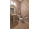Powder room with pedestal sink, toilet, floral wallpaper, and decorative oval mirror at 6486 Somersby Dr., Murrells Inlet, SC 29576