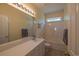 Well-lit bathroom with vanity, large mirror, and a shower-tub combo at 6486 Somersby Dr., Murrells Inlet, SC 29576