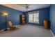 Blue bedroom with a rocking chair and a floor lamp at 6486 Somersby Dr., Murrells Inlet, SC 29576